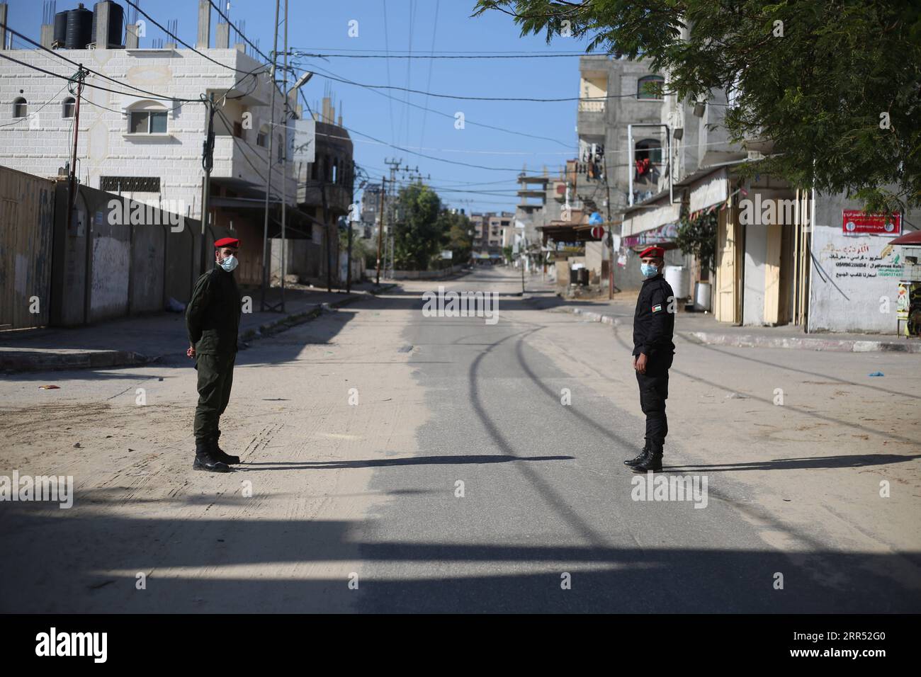 201219 -- GAZA, Dec. 19, 2020 -- Palestinian policemen stand guard in the Gaza Strip city of Rafah amid a lockdown, on Dec. 19, 2020. A full lockdown and curfew have been imposed in the West Bank and the Gaza Strip to curb the growing numbers of COVID-19 infections and deaths. Photo by /Xinhua MIDEAST-GAZA-RAFAH-COVID-19-LOCKDOWN KhaledxOmar PUBLICATIONxNOTxINxCHN Stock Photo