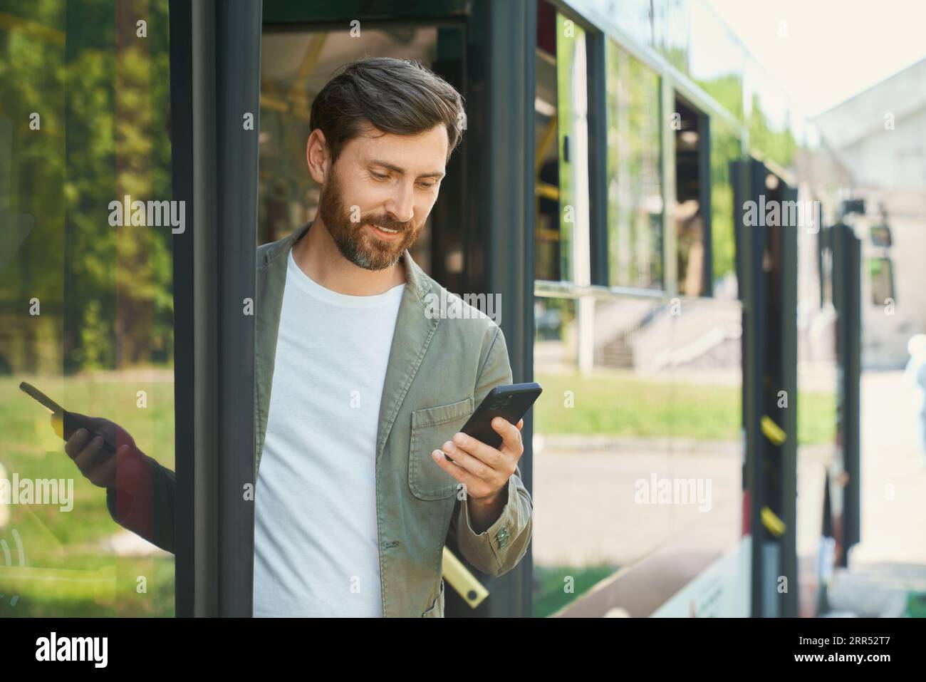 Exiting businessman holding smartphone hi-res stock photography and ...