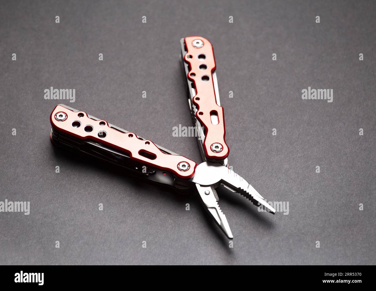 universal multifunctional knife pliers with different nozzles and a red