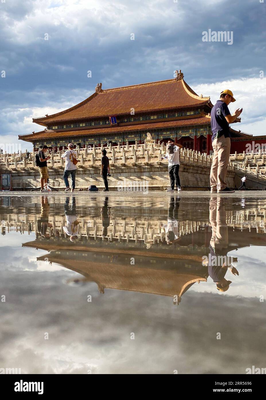 201224 -- BEIJING, Dec. 24, 2020 -- Photo taken with a mobile phone shows a view in the Palace Museum after rainfall in Beijing, capital of China, Sept. 1, 2020. The year 2020 marks the 600th anniversary of the Forbidden City. Constructed from 1406 to 1420, the Forbidden City measures 961 meters from north to south and 753 meters from east to west, spanning an area of around 720,000 square meters. Featuring red walls and yellow glazed roof tiles, it represents the culmination of traditional Chinese palatial architecture, influencing cultural and architectural developments in East Asia and surr Stock Photo