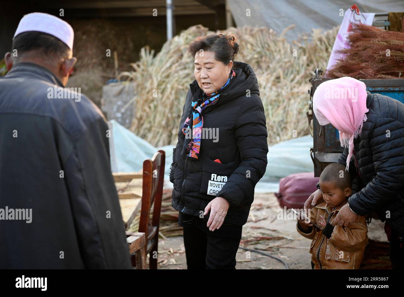 201225 -- YINCHUAN, Dec. 25, 2020 -- Ding Haiyan2nd L visits villagers to learn about their recent condition in Hejiayuan Village of Xihaigu in northwest China s Ningxia Hui Autonomous Region, Oct. 28, 2020. Xihaigu, a largely mountainous region in northwest Ningxia, was once inflicted by deep poverty and labeled the most unfit place for human settlement by the United Nations in the 1970s due to land reclamation, drought, and a fragile ecological environment. On Nov. 16, 2020, Xihaigu historically bid farewell to absolute poverty, during which she power played an indispensable role. Ding Haiya Stock Photo