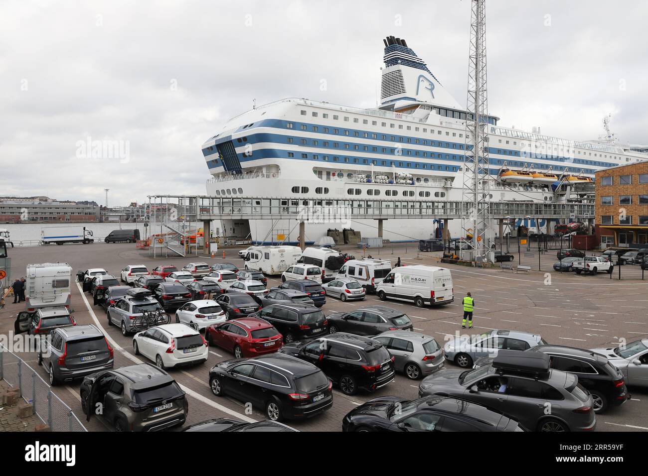 Helsinki, Finland - September 5, 2023: Vehicles waiting to board the  cruise ferry Silja Symphony which departs for Stockholm within an hour. Stock Photo