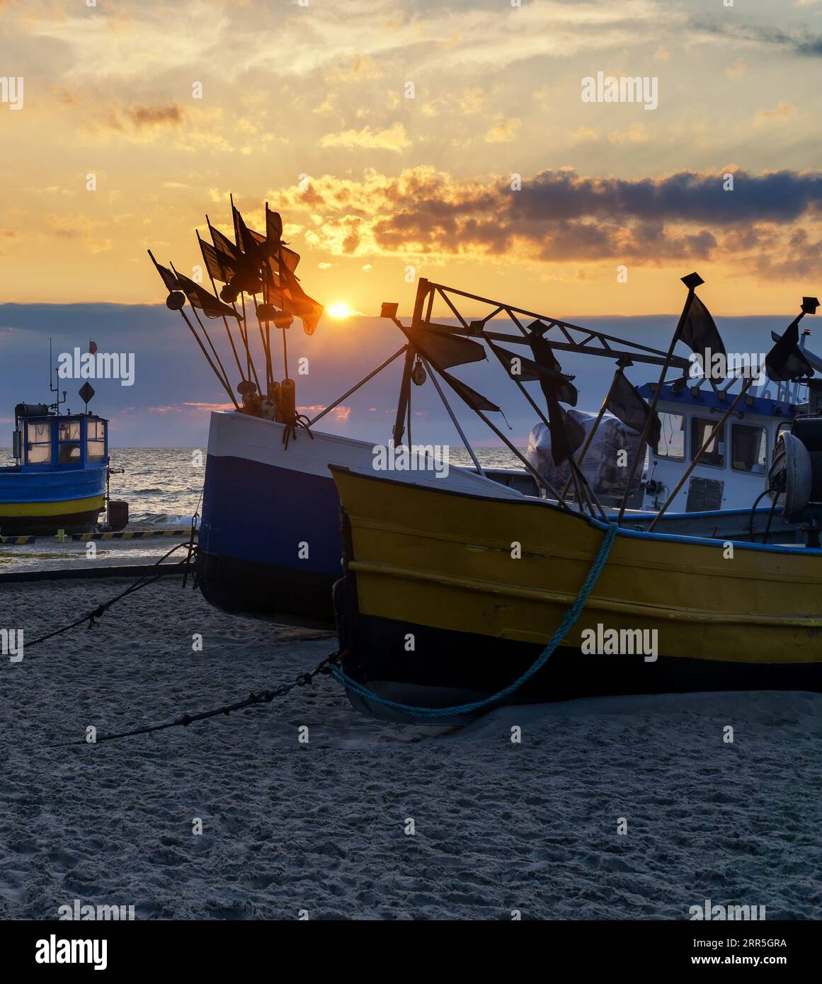 Beach sunset with boats hi-res stock photography and images - Alamy