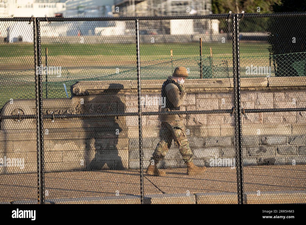 210108 -- WASHINGTON, D.C., Jan. 8, 2021 -- A security staff member is seen near the U.S. Capitol building a day after supporters of U.S. President Donald Trump stormed it in Washington, D.C., the United States, Jan. 7, 2021.  U.S.-WASHINGTON, D.C.-CAPITOL LiuxJie PUBLICATIONxNOTxINxCHN Stock Photo