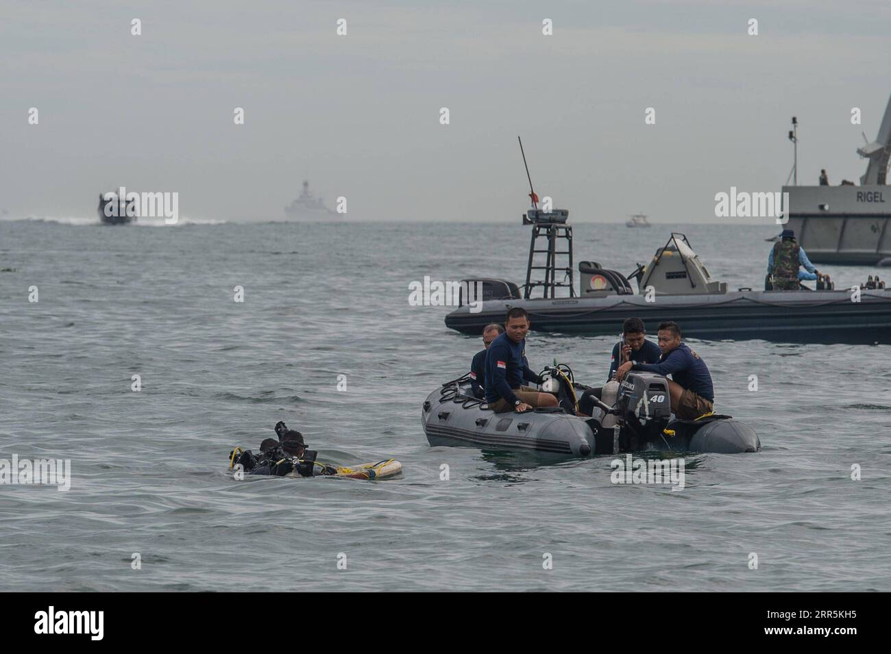 210110 -- LANCANG ISLAND, Jan. 10, 2021 -- Navy special force conducts a search operation at the plane crash site of the Sriwijaya Air flight SJ-182 in the waters of Lancang Island, north of Jakarta, Indonesia, Jan. 10, 2021. Indonesian authorities said on Sunday that they have found body parts and stuffs suspected to belong to passengers of Indonesia s Sriwijaya Air plane that crashed into waters off Jakarta. Ships and aircraft from various Indonesian agencies have been involved in the search for the Boeing 737-500 plane which crashed shortly after takeoff with 62 people aboard on Saturday. Stock Photo
