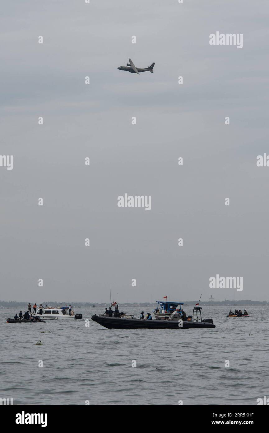 210110 -- LANCANG ISLAND, Jan. 10, 2021 -- Rescue team conducts a search operation at the plane crash site of the Sriwijaya Air flight SJ-182 in the waters of Lancang Island, north of Jakarta, Indonesia, Jan. 10, 2021. Indonesian authorities said on Sunday that they have found body parts and stuffs suspected to belong to passengers of Indonesia s Sriwijaya Air plane that crashed into waters off Jakarta. Ships and aircraft from various Indonesian agencies have been involved in the search for the Boeing 737-500 plane which crashed shortly after takeoff with 62 people aboard on Saturday.  INDONES Stock Photo