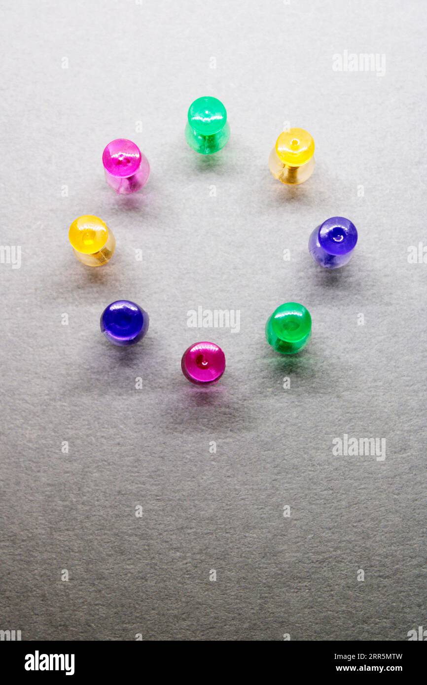 Group of thumbtacks formed in circle Stock Photo