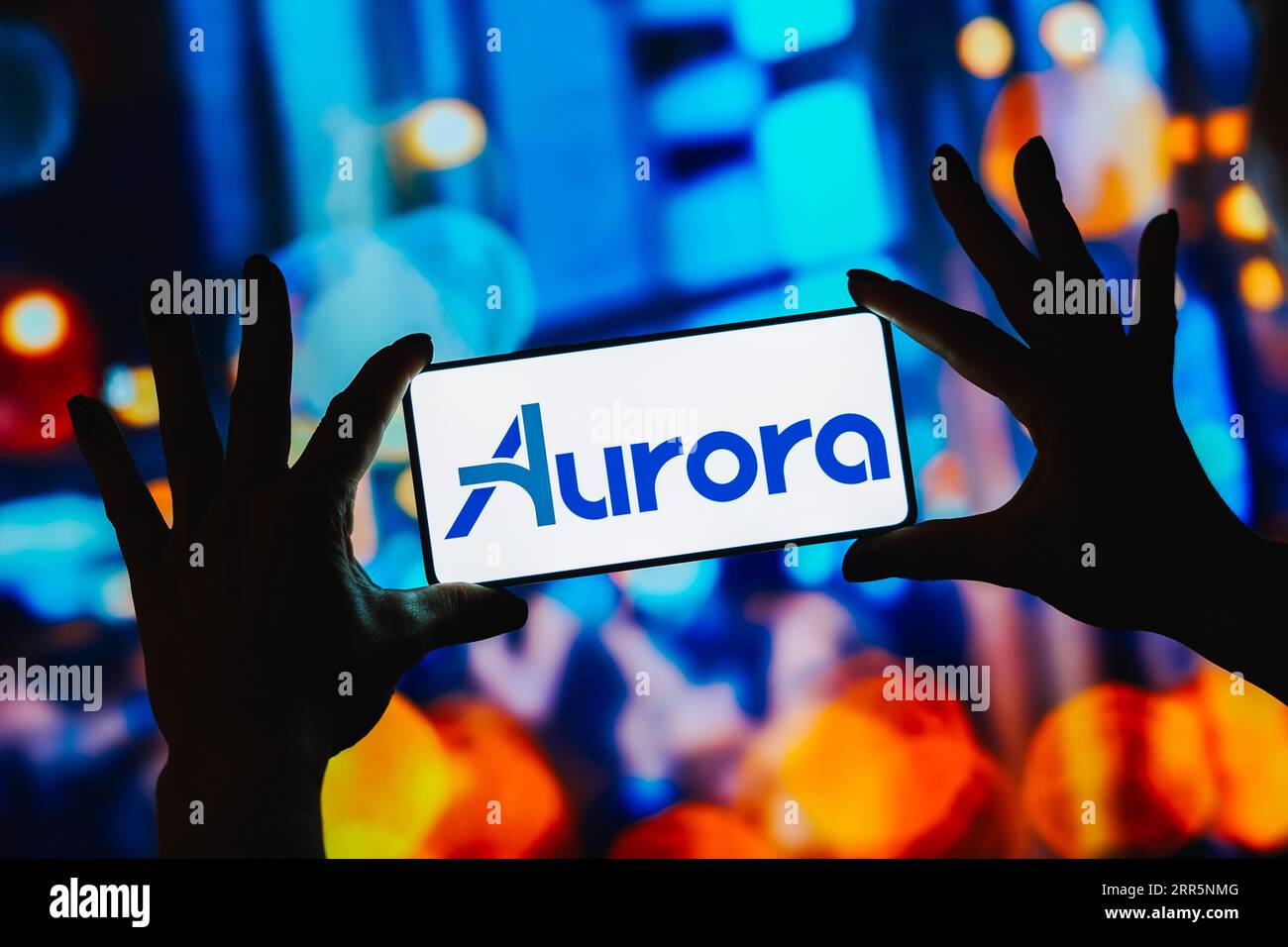 In this photo illustration, the Aurora Innovation logo is displayed on