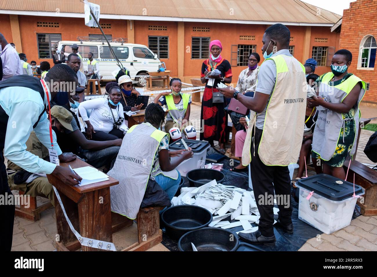 210114 -- NAJJERA UGANDA, Jan. 14, 2021 -- Staff members count ballots at a polling station in Najjera, Wakiso District, Uganda, on Jan. 14, 2021. Vote counting in Uganda s Thursday presidential and parliamentary elections has started with the country s electoral body saying results are expected to be released in 48 hours. Photo by /Xinhua UGANDA-NAJJERA-GENERAL ELECTIONS-VOTE COUNTING HajarahxNalwadda PUBLICATIONxNOTxINxCHN Stock Photo