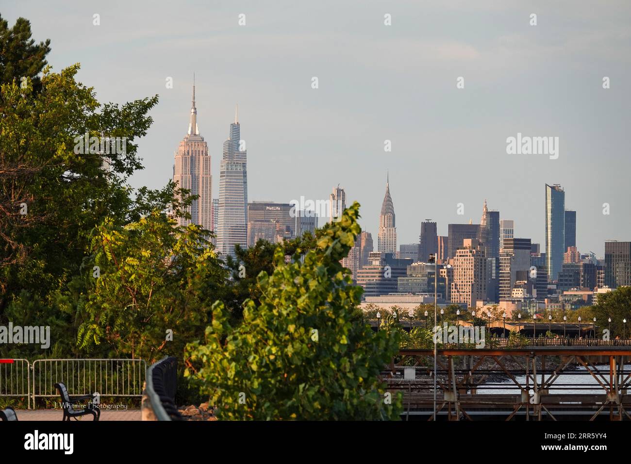 The skyline of Manhattan as seen from across the Hudson in New Jersey features such iconic buildings as Chrysler, Empire State and Freedom Tower Stock Photo
