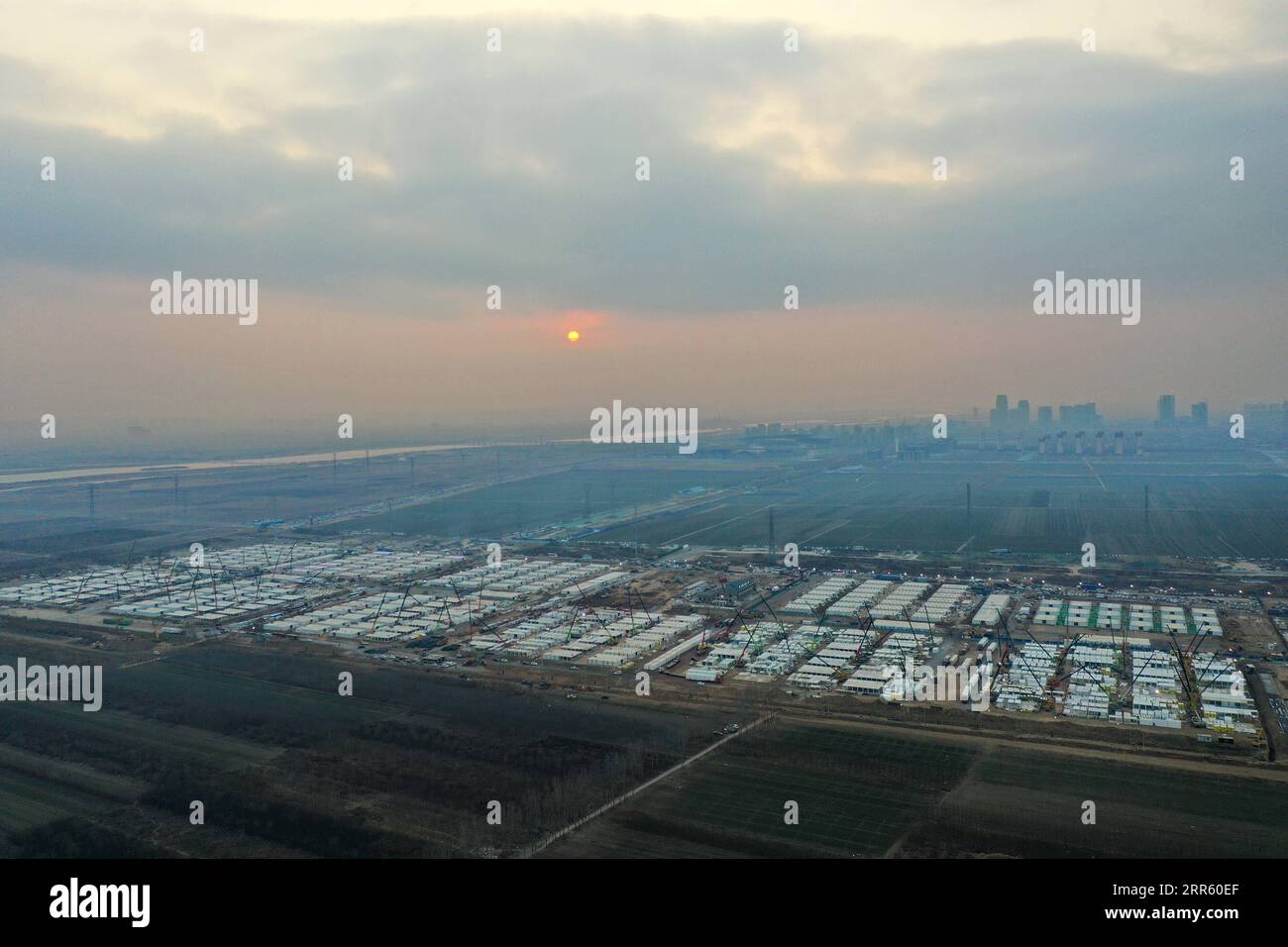 210120 -- SHIJIAZHUANG, Jan. 20, 2021 -- Aerial photo taken on Jan. 19, 2021 shows the construction site of Huangzhuang apartment COVID-19 quarantine center in Shijiazhuang, north China s Hebei Province. Cao Zepan, a technician of China Railway 14th Bureau Group, went to Shijiazhuang to aid the construction of the COVID-19 quarantine center with his colleagues on Jan. 16. Born in 2000, Cao is new but devoted to his work. Cao and other workers stick to their posts despite harsh winter weather, and work around the clock to guarantee the on-time completion of the construction. This is the first k Stock Photo