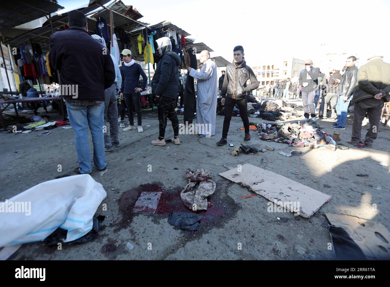 210121 -- BAGHDAD, Jan. 21, 2021  -- Photo taken on Jan. 21, 2021 shows the market damaged by suicide bombings in Iraq s capital Baghdad. At least 32 people were killed and 110 others wounded on Thursday in the twin suicide bombings in Iraq s capital Baghdad, Iraqi Health Minister Hassan al-Tamimi said. Baghdad s hospitals received 32 bodies, while 110 wounded people were admitted for treatment, al-Tamimi said in a statement. Earlier in the morning, a suicide bomber blew up his explosive belt in a crowded outdoor clothing market in Bab al-Sharji area, before a second one detonated his a few mi Stock Photo