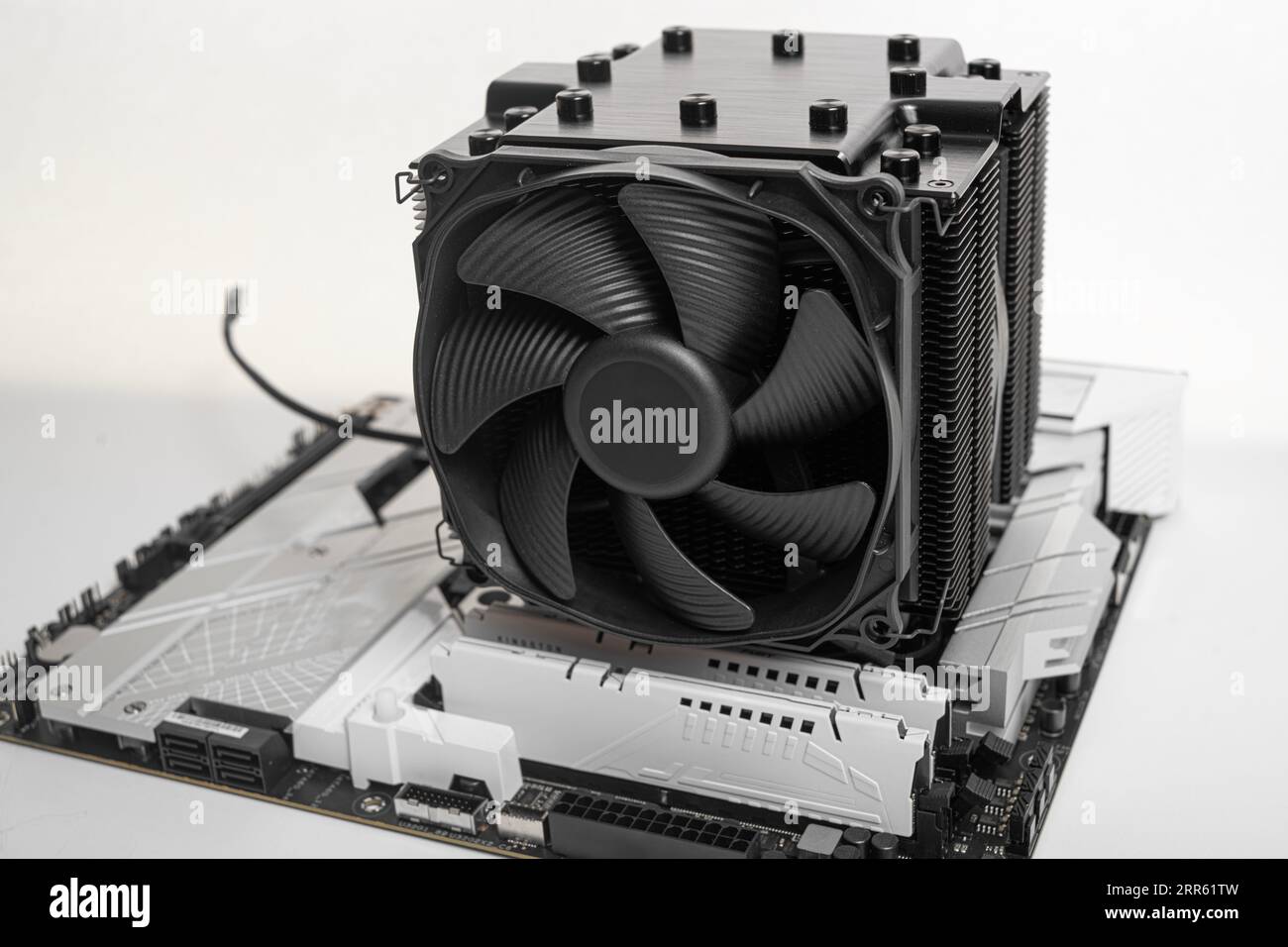 Installing a large cooler on a computer processor. Stock Photo
