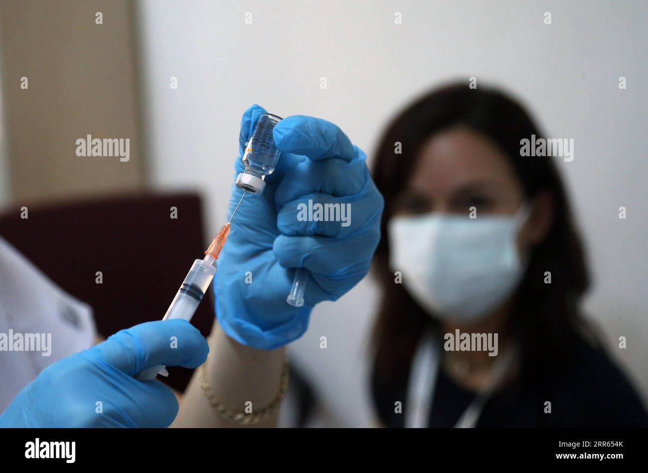 210126 -- ANKARA, Jan. 26, 2021 -- A nurse prepares a dose of the COVID-19 vaccine at a health center in Ankara, Turkey, on Jan. 26, 2021. Turkey reported on Tuesday 7,103 new COVID-19 cases, including 681 with symptoms, raising the total number in the country to 2,442,350. Photo by /Xinhua TURKEY-ANKARA-COVID-19-VACCINE MustafaxKaya PUBLICATIONxNOTxINxCHN Stock Photo