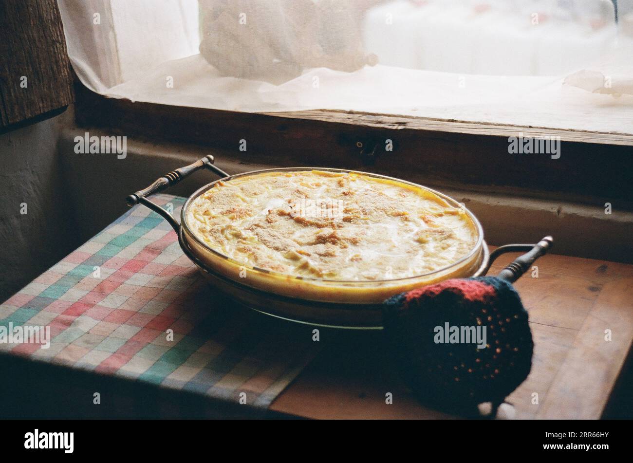 Salt cod pie cooling on kitchen table Stock Photo Alamy