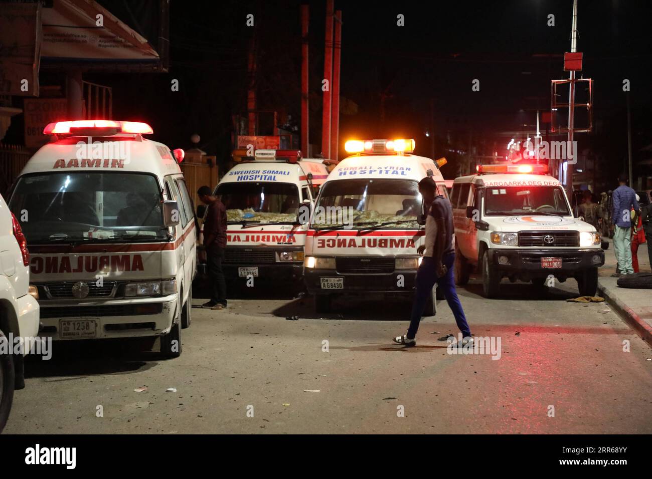 210201 -- MOGADISHU, Feb. 1, 2021 -- Ambulances are seen near Afrik Hotel in Mogadishu, capital of Somalia, Feb. 1, 2021. At least five people were killed and several others injured in a suicide car bombing in the Somali capital Mogadishu on Sunday evening, police and witnesses said. The latest attack started at 5.00 p.m. when a car packed with explosives exploded at the Afrik Hotel near a busy security checkpoint near Aden Adde International Airport in Mogadishu.  SOMALIA-MOGADISHU-SUICIDE CAR BOMBING HassanxBashi PUBLICATIONxNOTxINxCHN Stock Photo