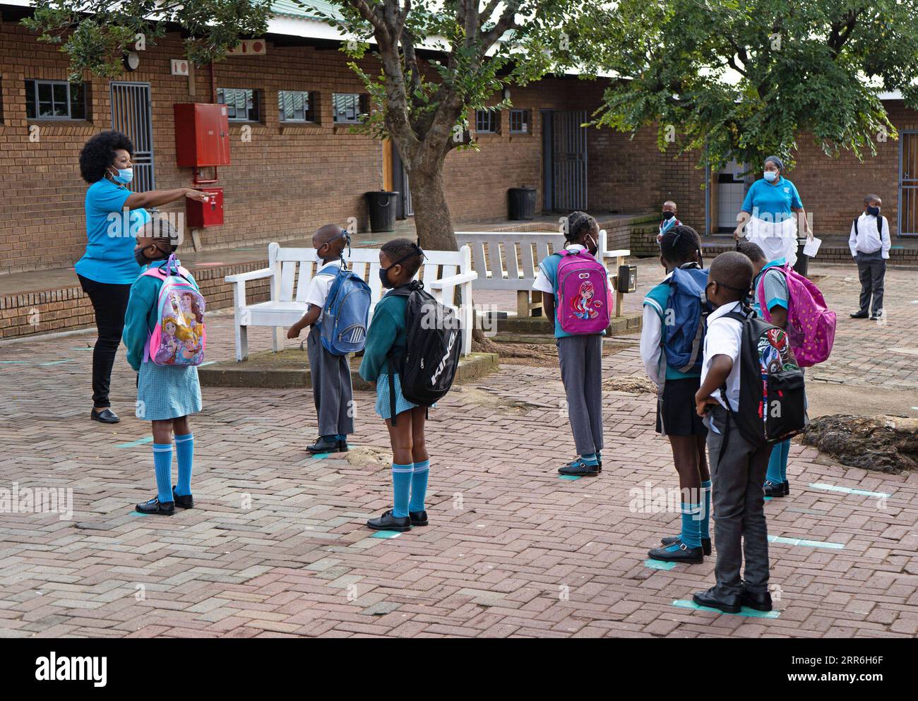 210216 -- JOHANNESBURG, Feb. 16, 2021 -- Pupils wait to enter the classroom at a primary school in Johannesburg, South Africa, Feb. 15, 2021. Over 20,000 public schools in South Africa were reopened in accordance with strict adherence to the COVID-19 protocol on Monday. Photo by /Xinhua SOUTH AFRICA-JOHANNESBURG-COVID-19-PUBLIC SCHOOL-REOPEN MatthewxMartinxBrink PUBLICATIONxNOTxINxCHN Stock Photo