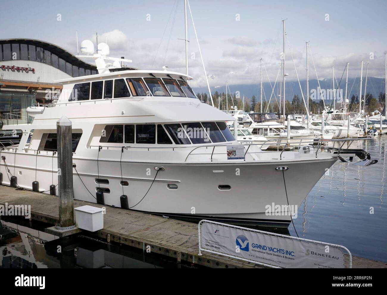 210224 -- VANCOUVER, Feb. 24, 2021 -- A cruiser boat for display during the 2021 Vancouver International Boat Show is seen at a harbour in Vancouver, British Columbia, Canada, Feb. 24, 2021. The Vancouver International Boat Show which goes virtual this year due to the COVID-19 pandemic, kicked off on Wednesday, showcasing hundreds of new boats, products and accessories online. Photo by /Xinhua CANADA-VANCOUVER-INTERNATIONAL BOAT SHOW LiangxSen PUBLICATIONxNOTxINxCHN Stock Photo
