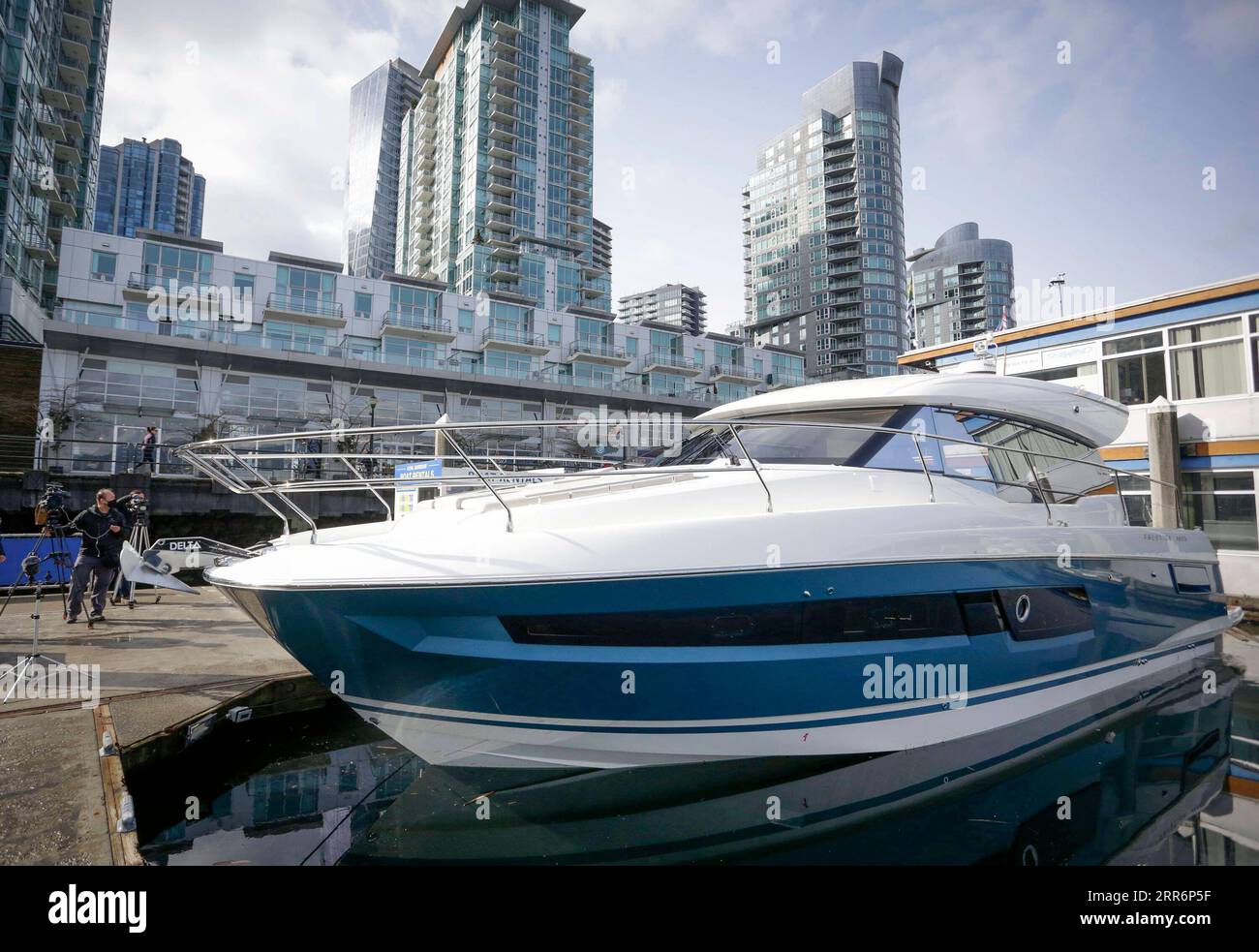 210224 -- VANCOUVER, Feb. 24, 2021 -- A cruiser boat for display during the 2021 Vancouver International Boat Show is seen at a harbour in Vancouver, British Columbia, Canada, Feb. 24, 2021. The Vancouver International Boat Show which goes virtual this year due to the COVID-19 pandemic, kicked off on Wednesday, showcasing hundreds of new boats, products and accessories online. Photo by /Xinhua CANADA-VANCOUVER-INTERNATIONAL BOAT SHOW LiangxSen PUBLICATIONxNOTxINxCHN Stock Photo