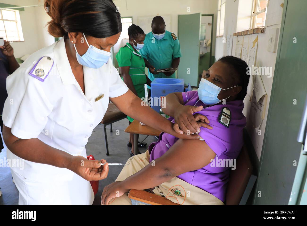 210302 -- MIDLANDS, March 2, 2021 -- A woman gets a jab of Sinopharm vaccine at a hospital in Gokwe, Midlands Province, Zimbabwe, on Feb. 22, 2021. Zimbabwean President Emmerson Mnangagwa on Monday lauded China for donating COVID-19 vaccines to Zimbabwe as the country embarks on its inoculation program. Photo by /Xinhua ZIMBABWE-PRESIDENT-CHINA-AIDED VACCINES Wanda PUBLICATIONxNOTxINxCHN Stock Photo