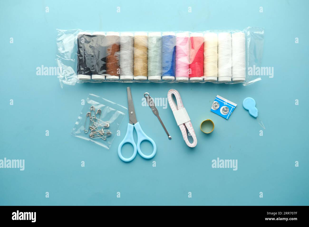 Tools and accessories for sewing on color background  Stock Photo