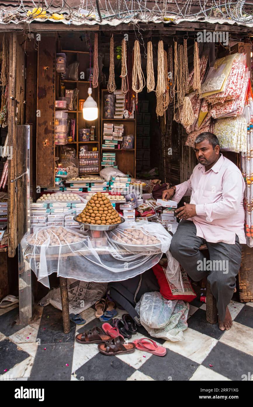 Vrindavan, Uttar Pradesh, October 19th 2019: A sweet seller selling his products inside the campus of Banke Bihari temple, Vrindavan Stock Photo