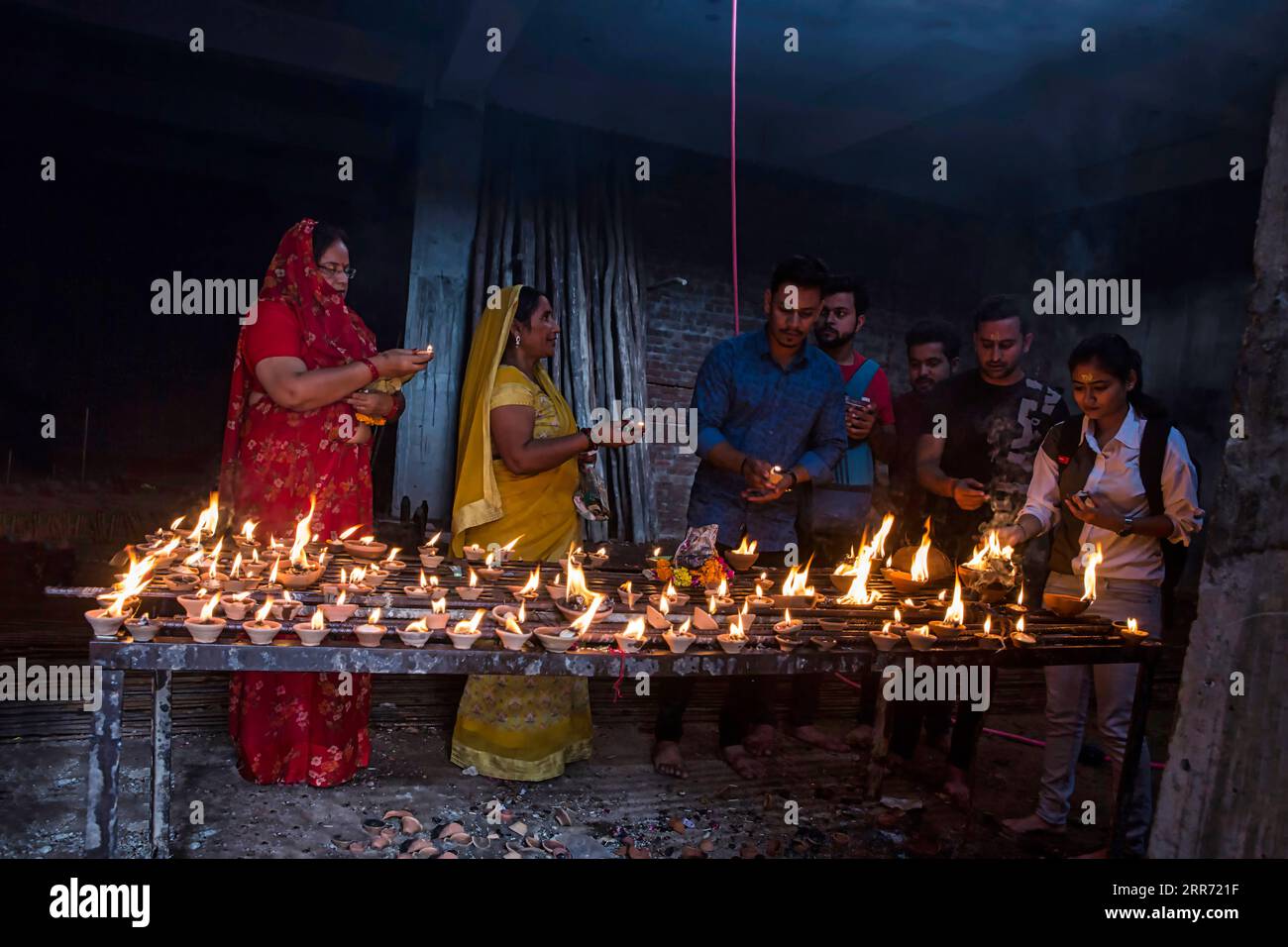 Vrindavan, Mathura, October 19th, 2020: Devotees lighting clay lamps to show there love and respect to Lord Shri Krishna at Banke Bihari temple Stock Photo