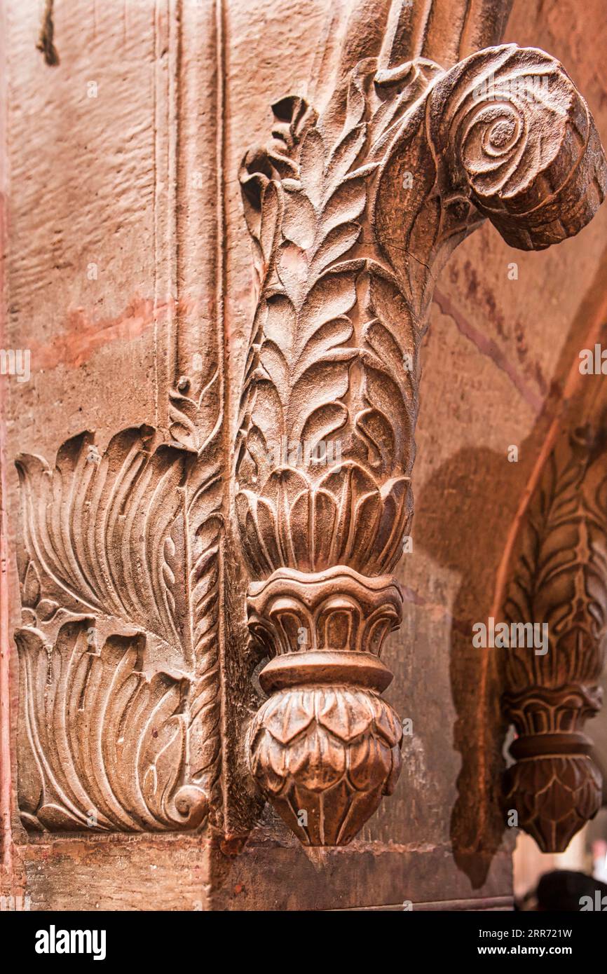 Vrindavan, Uttar Pradesh, October 19th 2019: Detail section of a stone curved pillar in the famous Banke Bihari Temple of Vrindavan. Stock Photo