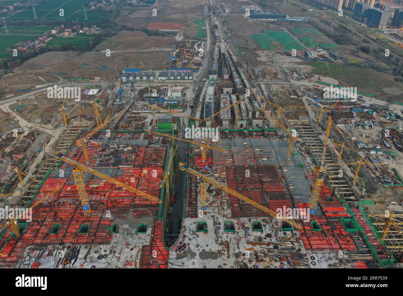 210312 -- HANGZHOU, March 12, 2021 -- Aerial photo taken on March 12, 2021 shows the construction site of Hangzhou West Railway Station in Hangzhou, capital of east China s Zhejiang Province. Hangzhou West Railway Station is a key support project for the 2022 Asian Games, and also a part of Hangzhou s grand plans to step up the infrastructure of the city. The construction of the comprehensive transportation hub that integrates multiple means of transportation is well underway.  CHINA-HANGZHOU-TRANSPORTATION HUB-CONSTRUCTION CN HuangxZongzhi PUBLICATIONxNOTxINxCHN Stock Photo
