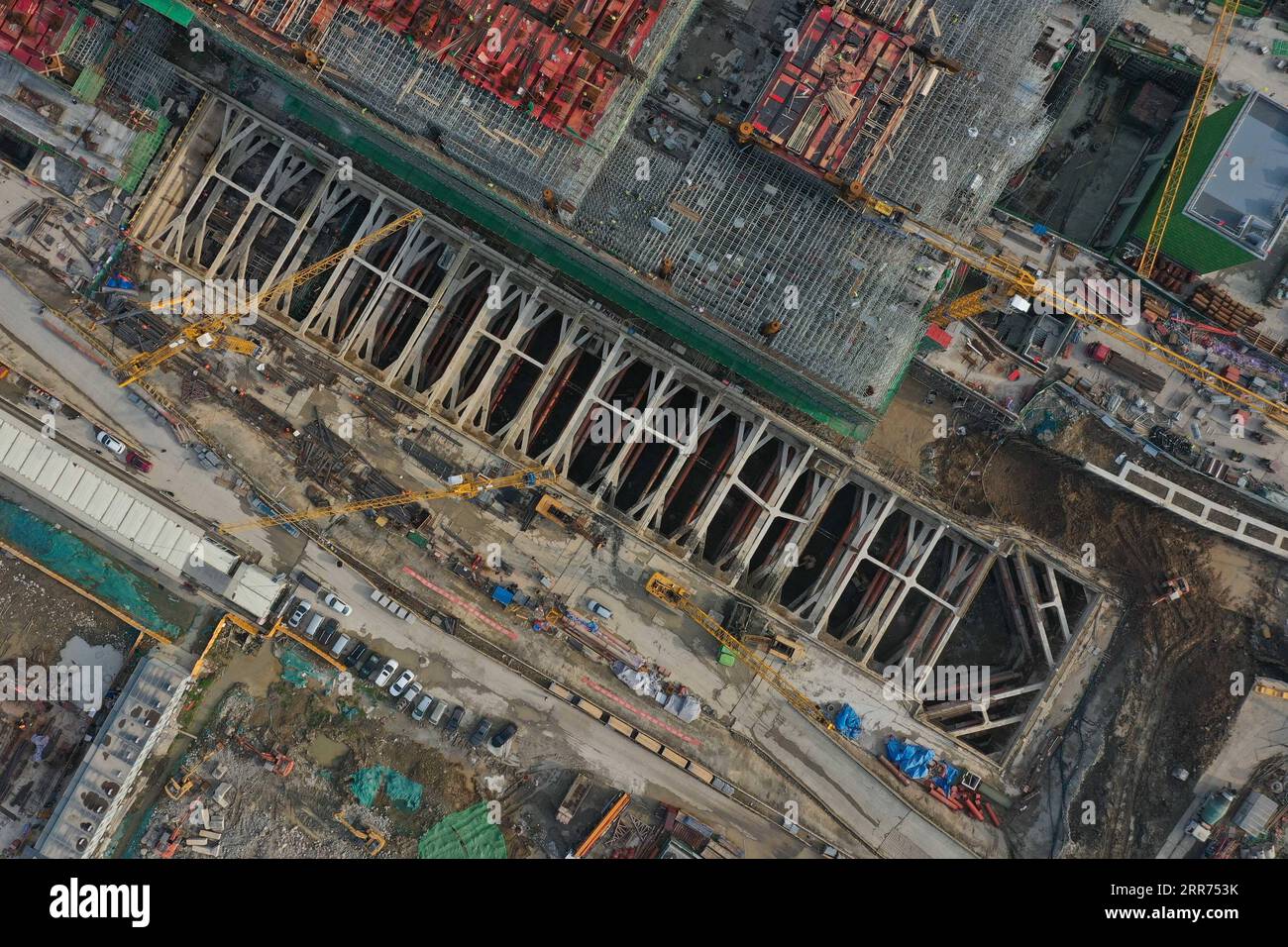 210312 -- HANGZHOU, March 12, 2021 -- Aerial photo taken on March 12, 2021 shows the construction site of Hangzhou West Railway Station in Hangzhou, capital of east China s Zhejiang Province. Hangzhou West Railway Station is a key support project for the 2022 Asian Games, and also a part of Hangzhou s grand plans to step up the infrastructure of the city. The construction of the comprehensive transportation hub that integrates multiple means of transportation is well underway.  CHINA-HANGZHOU-TRANSPORTATION HUB-CONSTRUCTION CN HuangxZongzhi PUBLICATIONxNOTxINxCHN Stock Photo