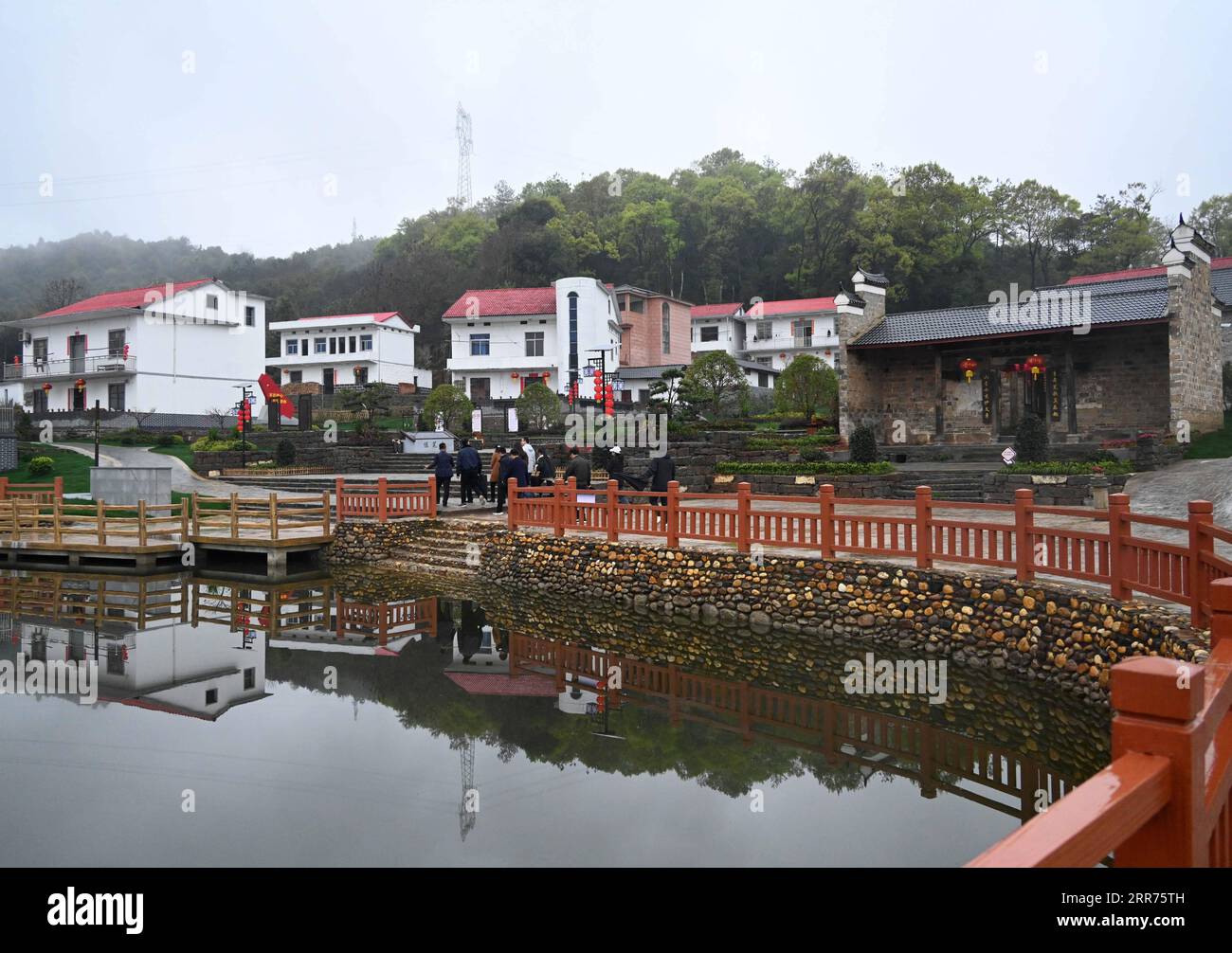 210314 -- NANCHANG, March 14, 2021 -- People tour in Moshan Village of Anyi County, east China s Jiangxi Province, March 11, 2021. Anyi County has put efforts into developing tourism industry by integrating natural and cultural resources.  CHINA-JIANGXI-ANYI-RURAL TOURISM CN PengxZhaozhi PUBLICATIONxNOTxINxCHN Stock Photo