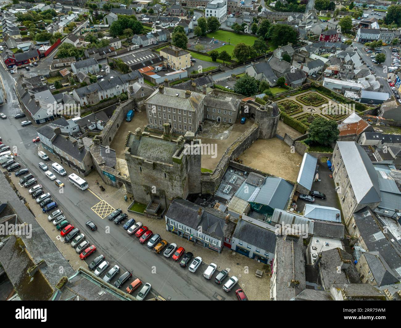 Aerial view of Roscrea castle and town in Central Ireland with tower house keep, enclosing walls with circular tower and garden Stock Photo