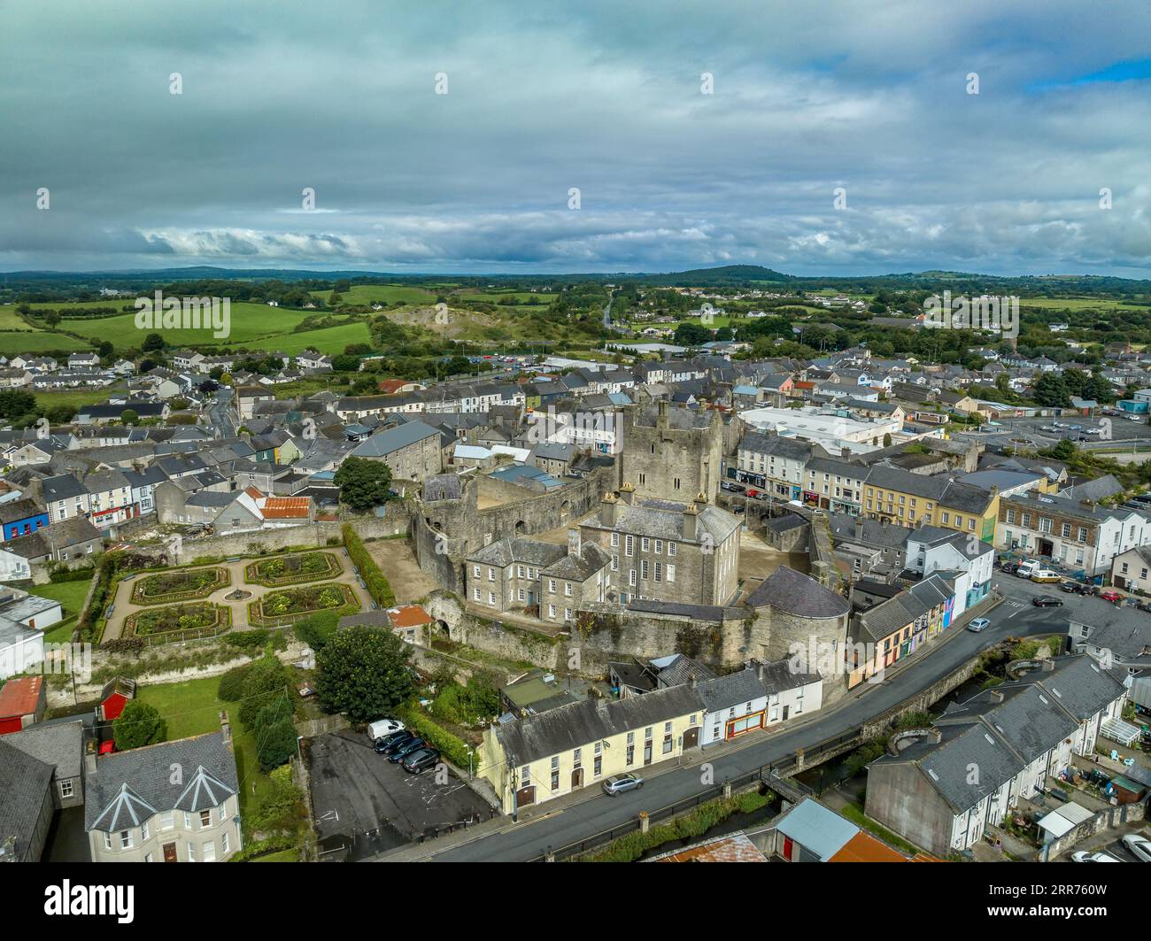 Aerial view of Roscrea castle and town in Central Ireland with tower house keep, enclosing walls with circular tower and garden Stock Photo