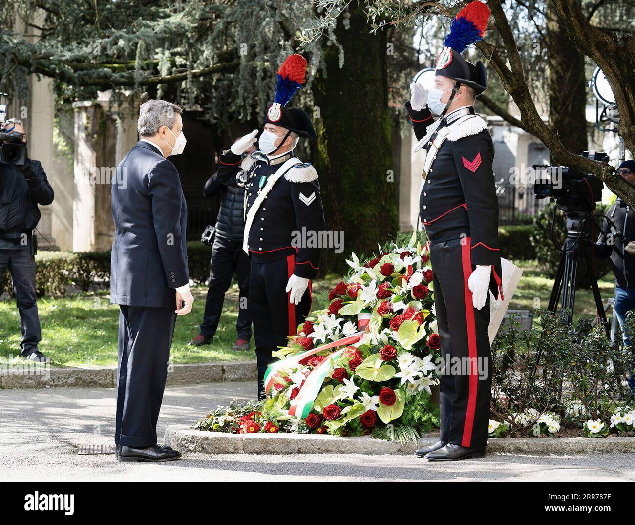 210319 -- BERGAMO, March 19, 2021 -- Italian Prime Minister Mario Draghi lays a flower wreath during an activity to mark the first National Day of Remembrance for COVID-19 victims in Bergamo, Italy, March 18, 2021. Italy on Thursday marked the first National Day of Remembrance for COVID-19 victims. According to the Health Ministry s data updated to Wednesday, Italy s death toll reached 103,432. Overall, it counts more than 3.2 million coronavirus cases, which included the deaths, plus over 2.6 million recoveries, and over 539,000 active infections. TO GO WITH Feature: Italy marks 1st National Stock Photo