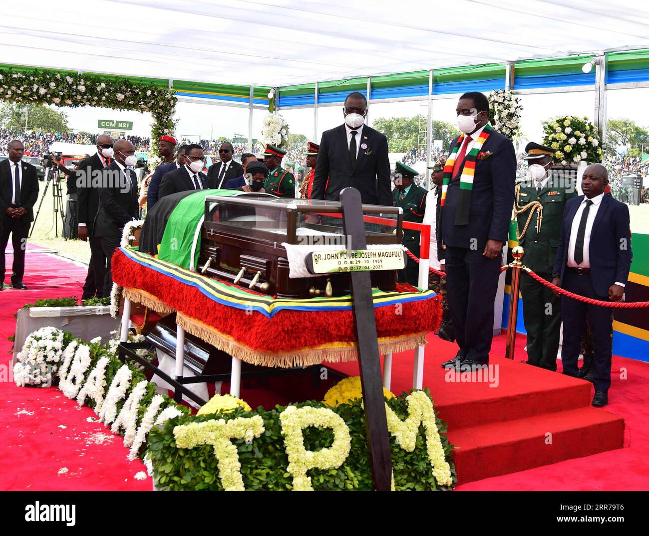 210322 -- DODOMA, March 22, 2021 -- Zimbabwean President Emmerson Mnangagwa 3rd R pays his respect to former Tanzanian President John Magufuli in Dodoma, capital of Tanzania, on March 22, 2021. Tanzania held a state funeral for John Magufuli at the Jamhuri Stadium in Dodoma on Monday, with the attendance of African leaders, representatives and other dignitaries. Magufuli, 61, died in office from a heart condition on March 17 in the country s commercial capital Dar es Salaam. /Handout via Xinhua TANZANIA-DODOMA-FORMER PRESIDENT-MAGUFULI-STATE FUNERAL TanzanianxStatexHouse PUBLICATIONxNOTxINxCHN Stock Photo