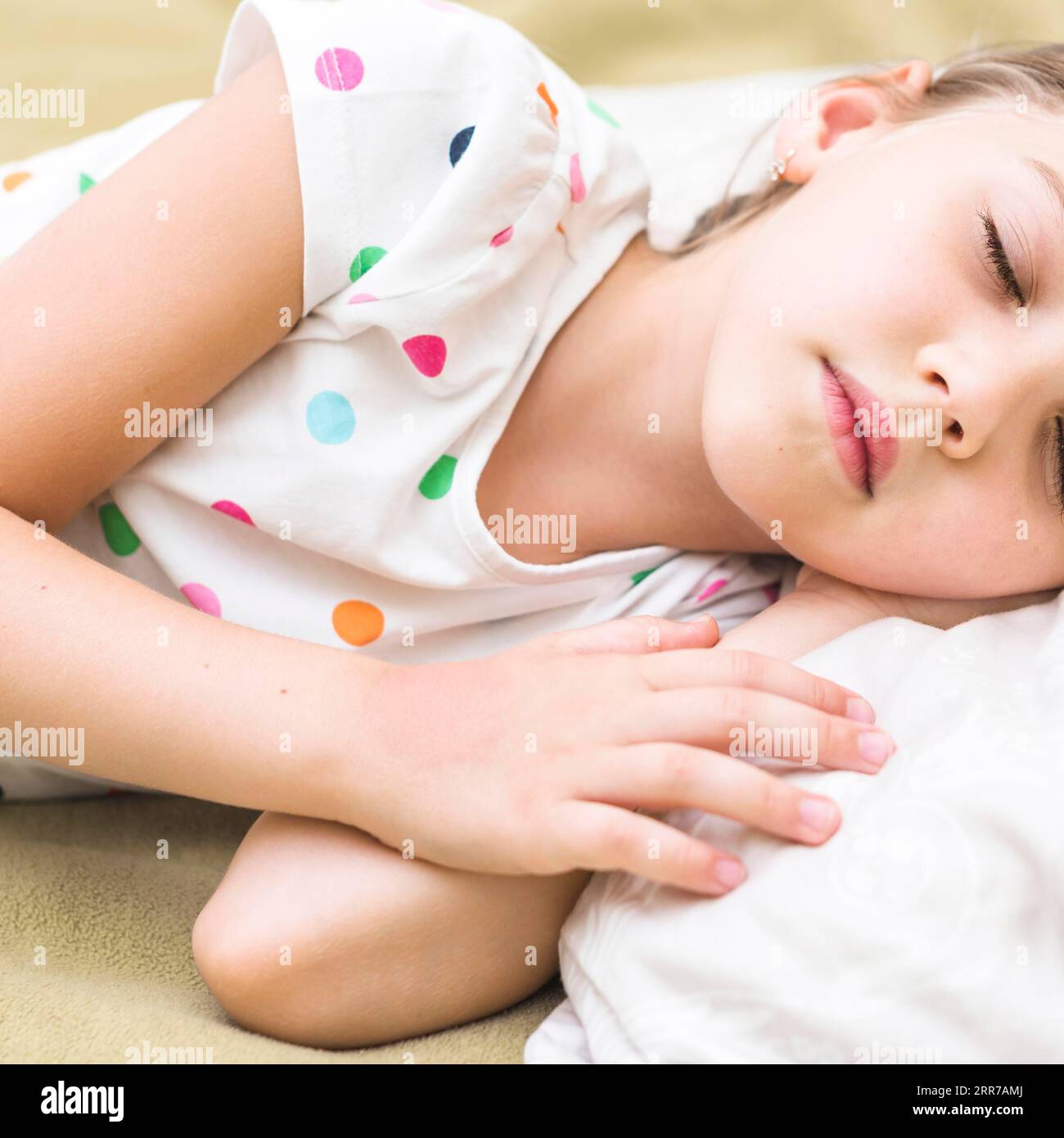 Close up cute little girl sleeping bed Stock Photo