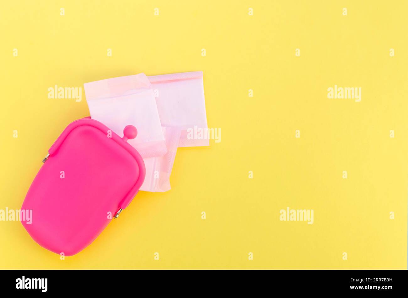 Pink purse with wrapped sanitary napkins Stock Photo Alamy