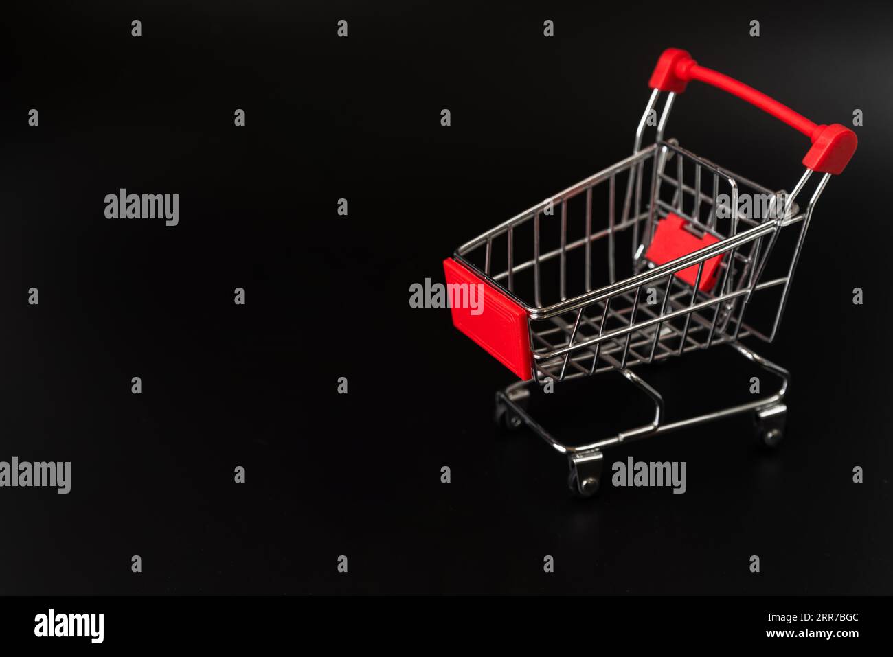Shopping cart dark background with copy space Stock Photo Alamy