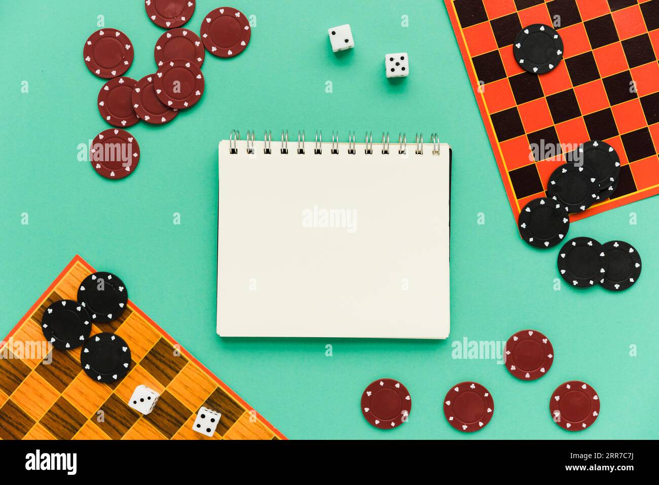 Top view society games with mock up notepad Stock Photo