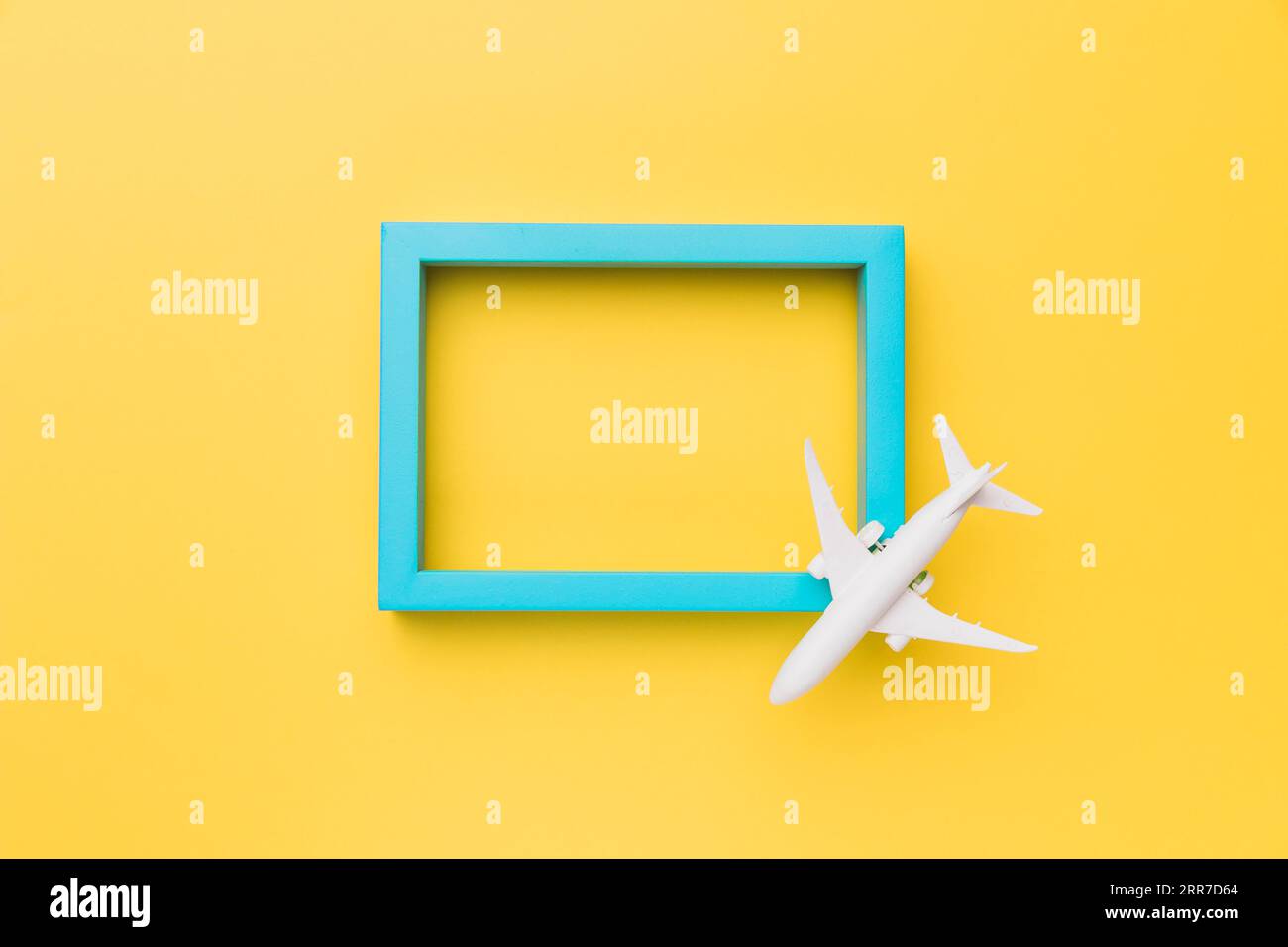 Composition small airplane blue frame Stock Photo Alamy