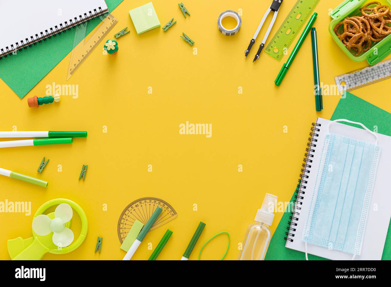 Flat lay back school materials with notebook face mask Stock Photo - Alamy