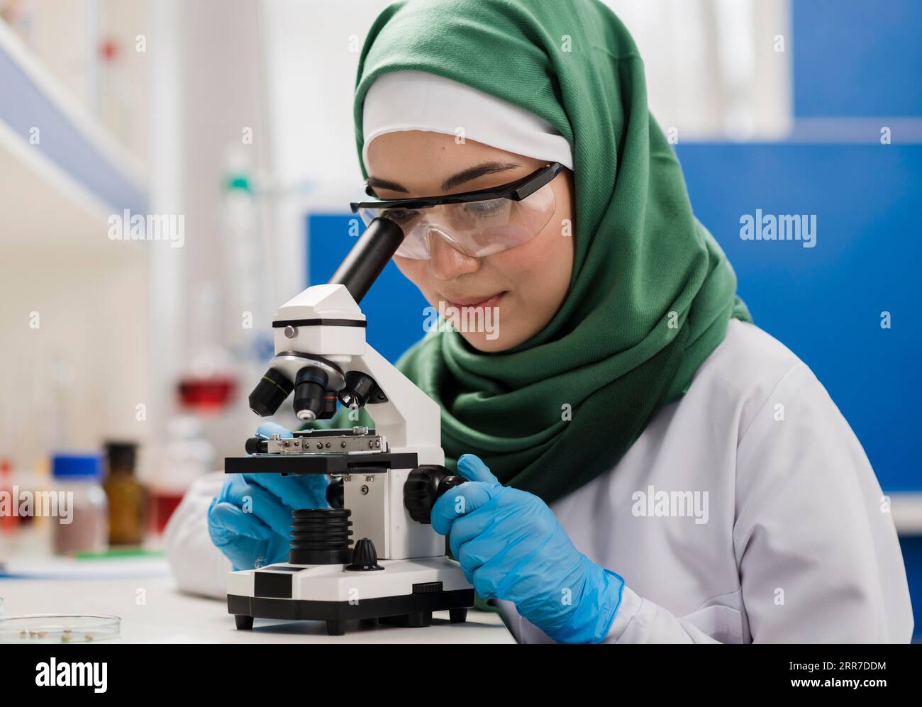 Female scientist with hijab microscope laboratory Stock Photo - Alamy