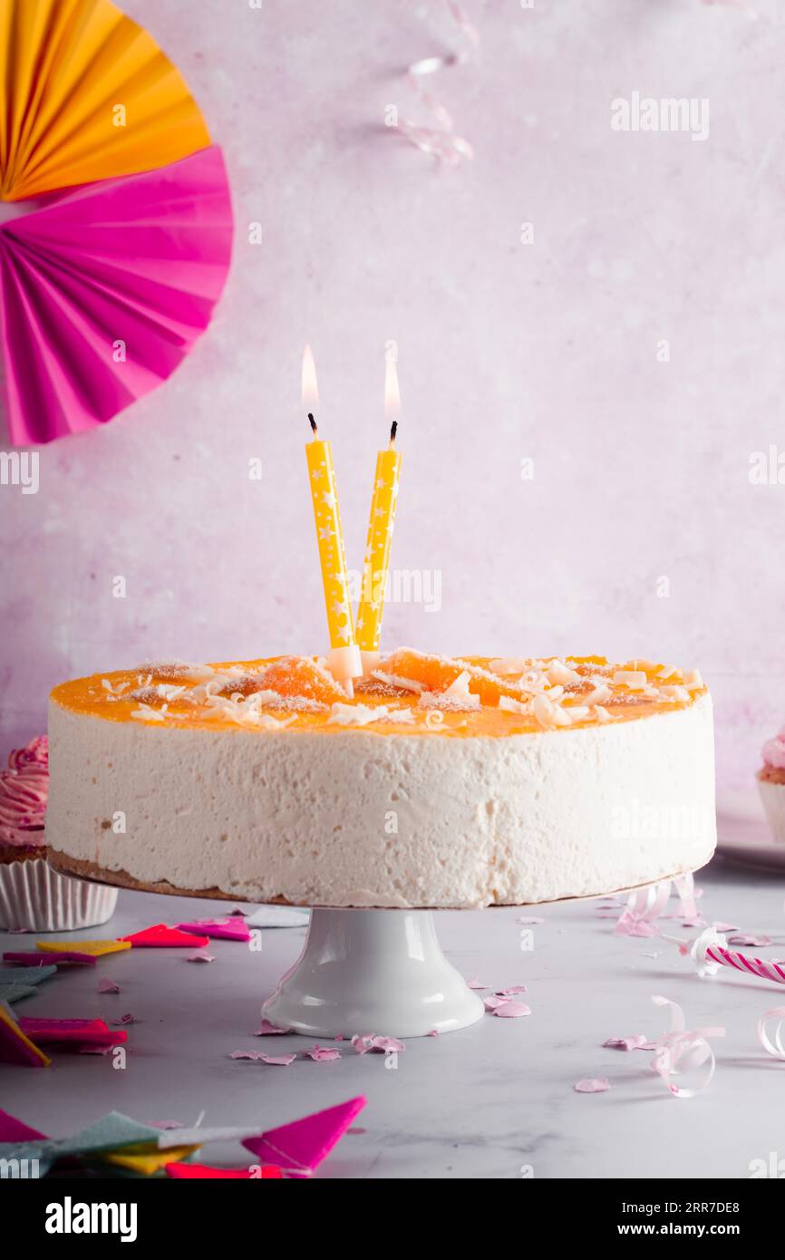 Birthday cake with lit candles Stock Photo - Alamy