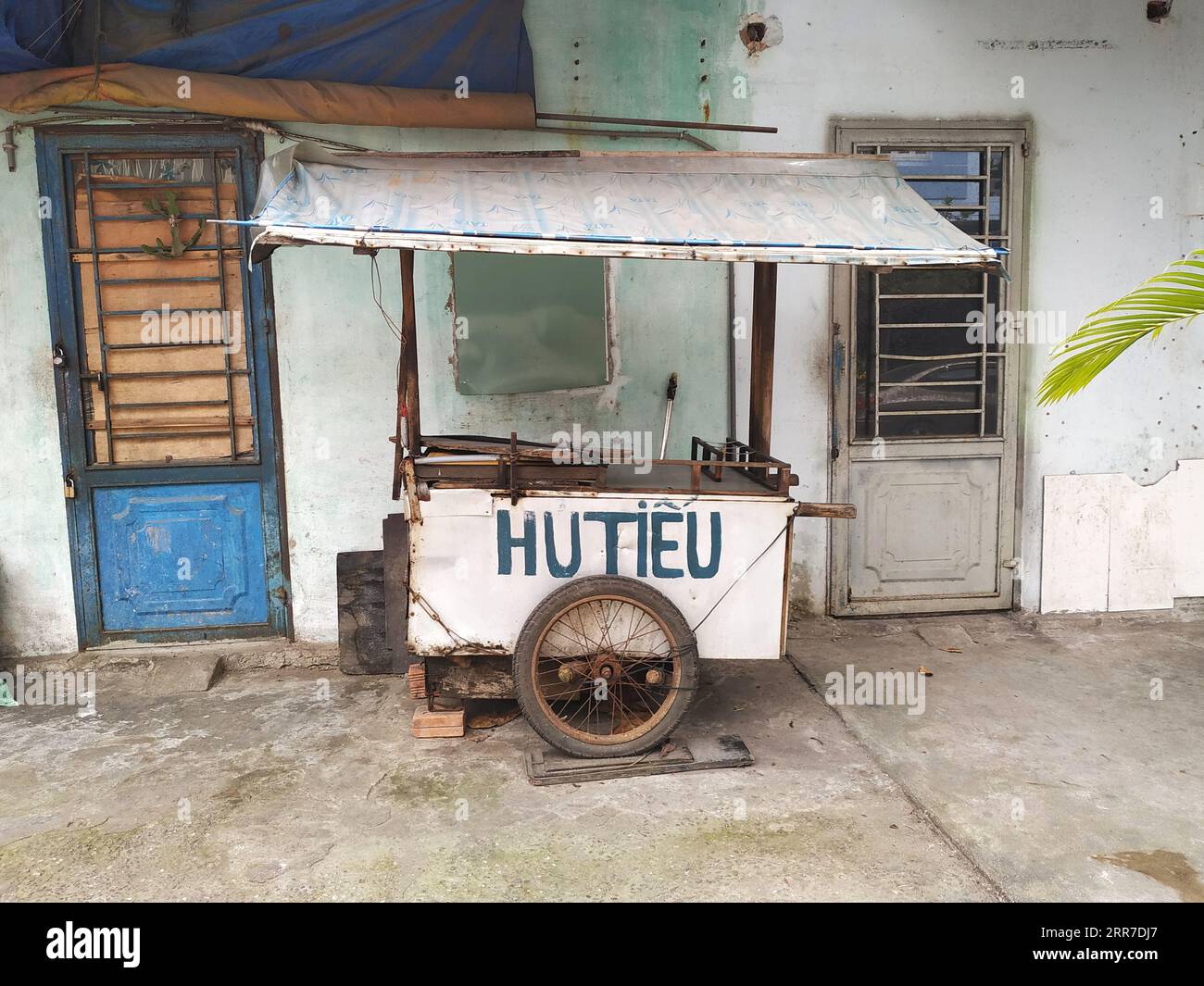 Funky food cart offering Hutieu, a type of flat rice noodle popular in southern Vietnam. Idle now, the cart will move to a busy street at dinner time Stock Photo