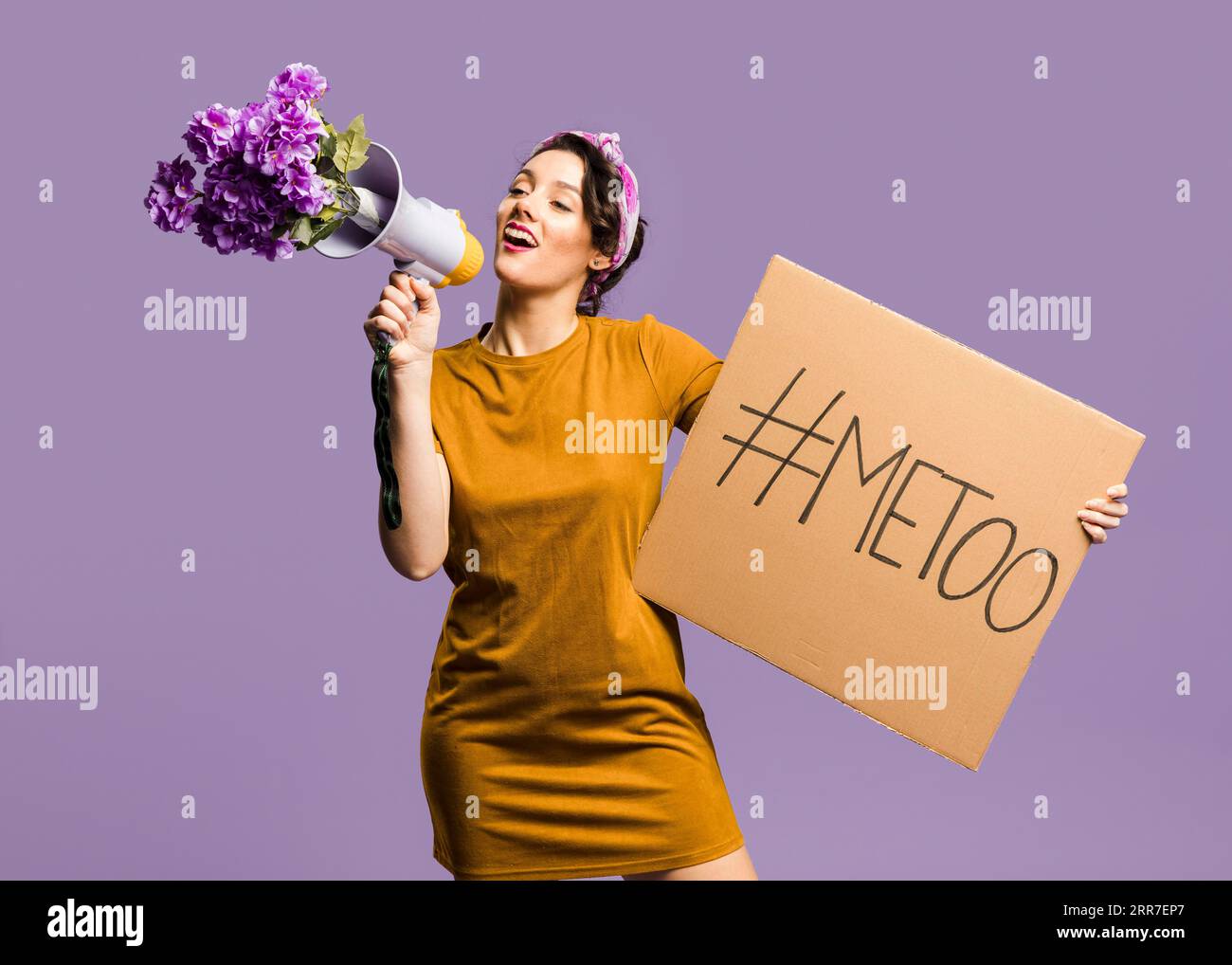 Woman talking megaphone holding cardboard with me too sign Stock Photo