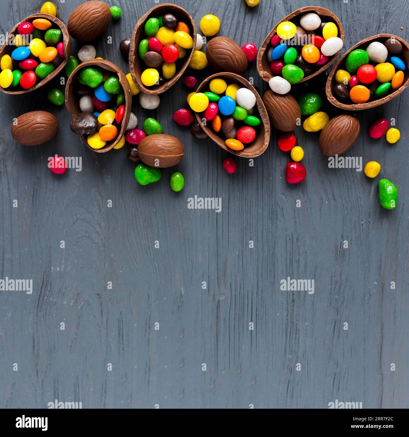 Chocolate eggs with colorful candies Stock Photo
