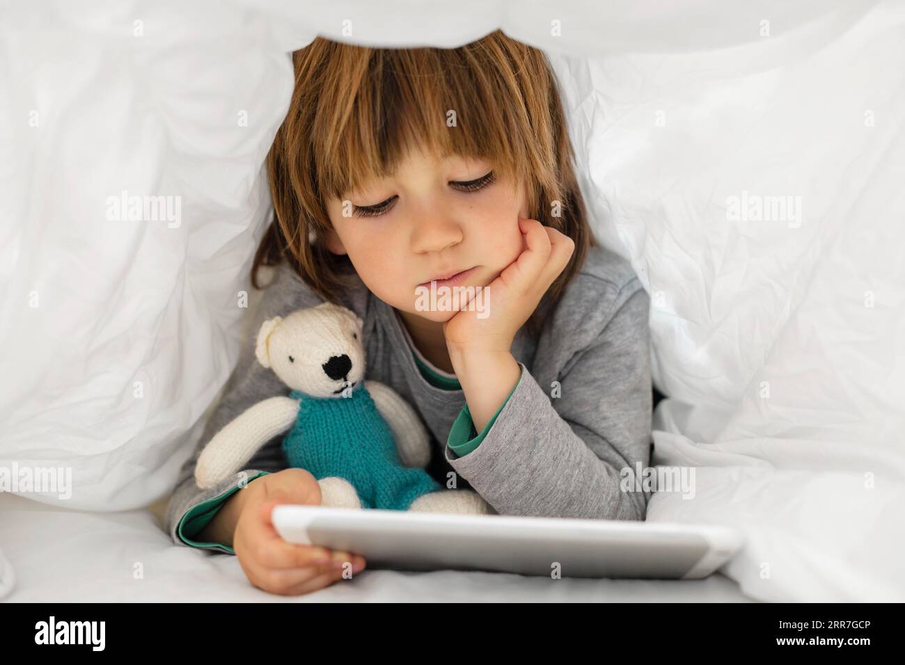 Little boy using tablet Stock Photo - Alamy