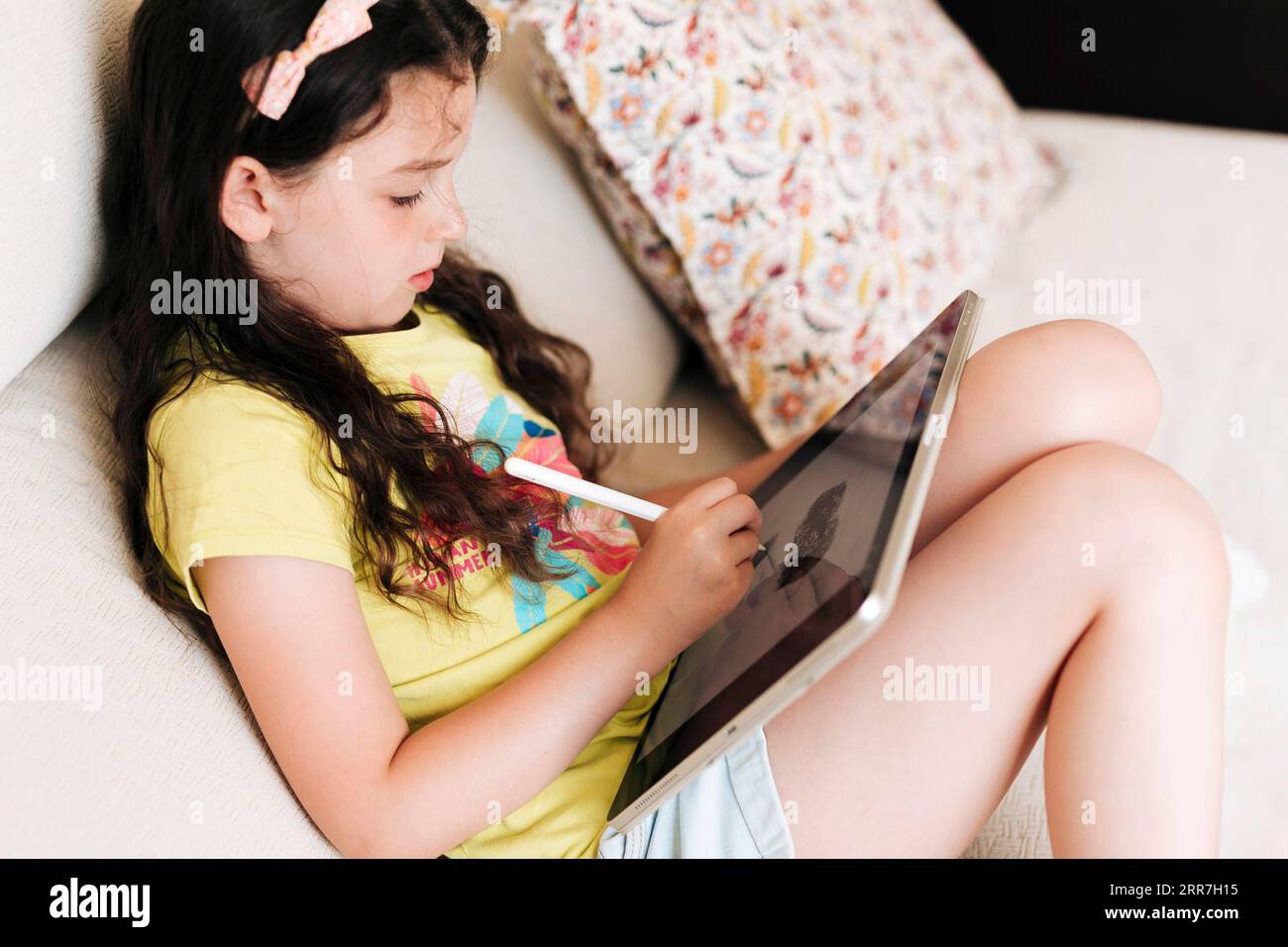 Side view girl drawing tablet Stock Photo - Alamy