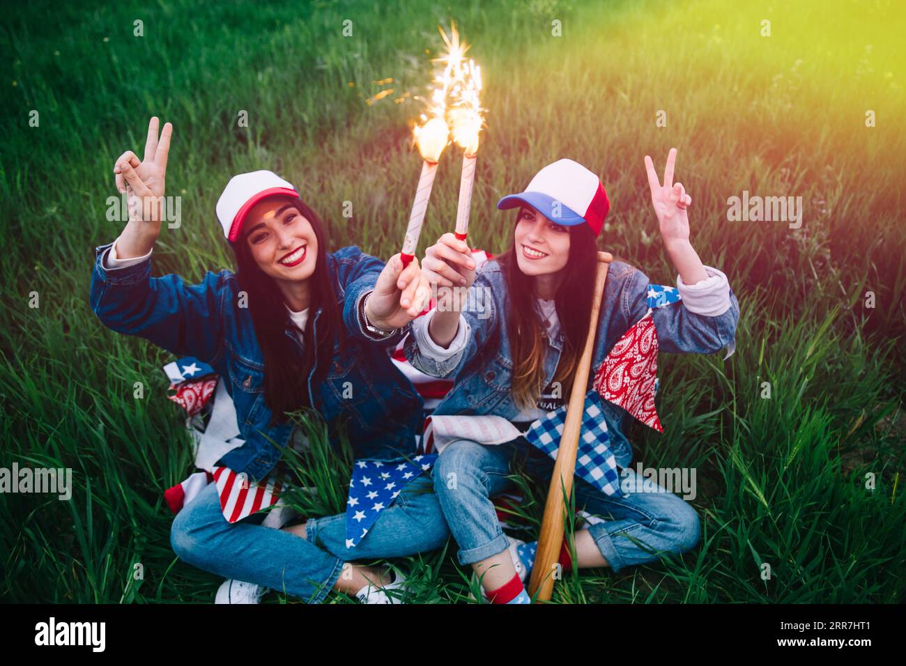 Women with fireworks hands smiling Stock Photo