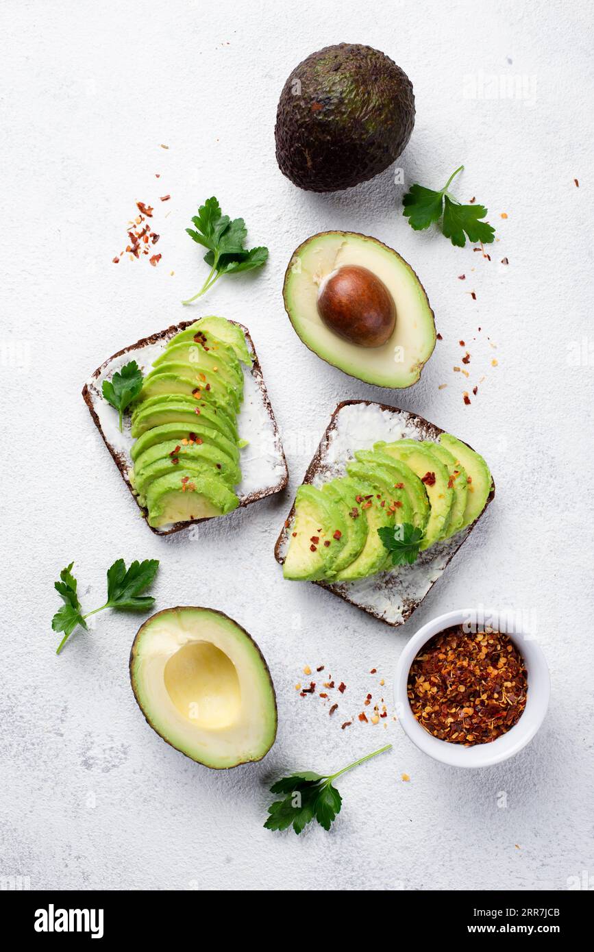 Flat lay avocado toast breakfast with herbs spices Stock Photo Alamy